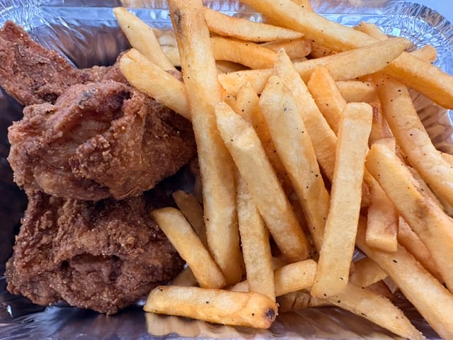 Jamaican- Style Fried Chicken with French Fries.
